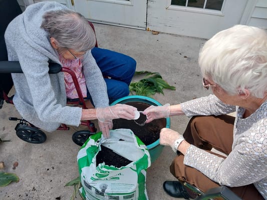 Residents engaging in gardening activity together