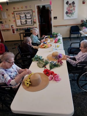 Residents engaging in a flower arrangement activity