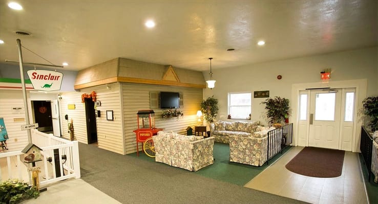 Bright common area with floral sofas and decor