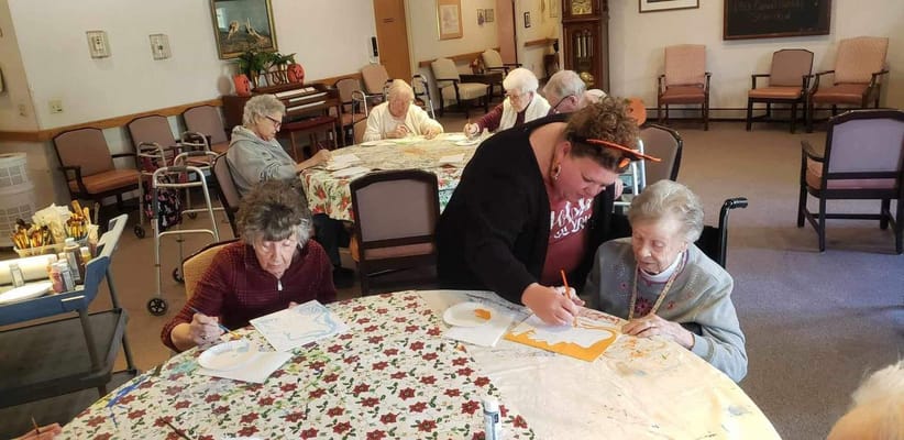 Residents participating in an art activity together