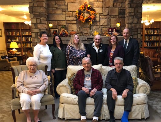 Residents and staff posing in a common area