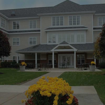 Building exterior with a patio and flowers