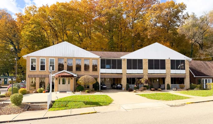 Exterior view of Rivercliff Terrace facility in autumn