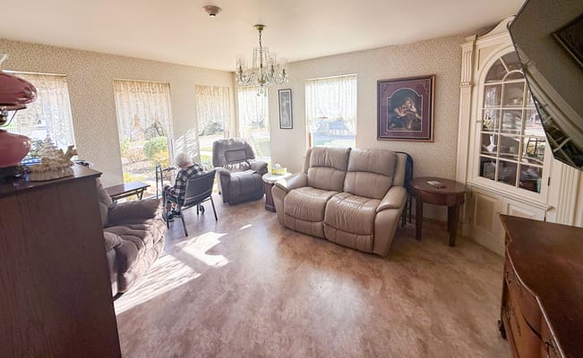 Common area with comfortable seating and sunlight.