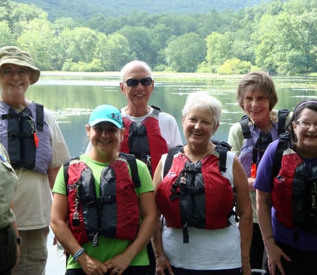 Residents enjoying a group activity by the water
