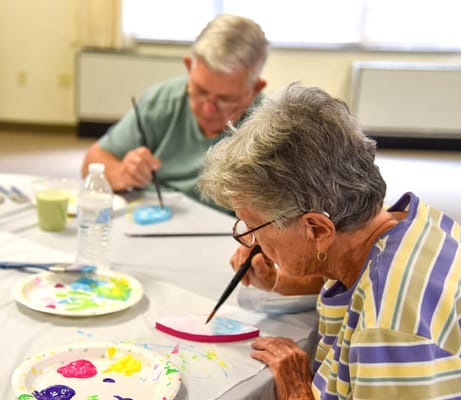 Residents engaged in an arts and crafts activity