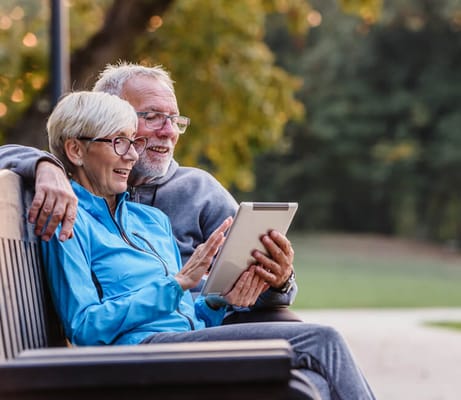 Couple enjoying time together outdoors on a bench
