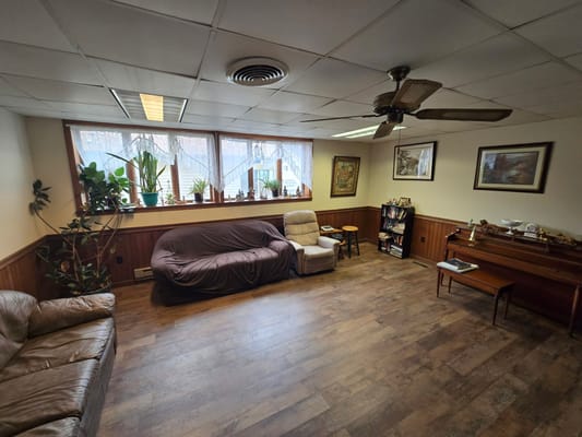 Interior view of a cozy common area with seating