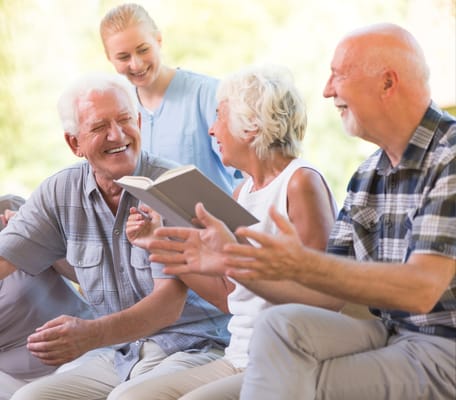 Residents engaging in a group activity, smiling and laughing