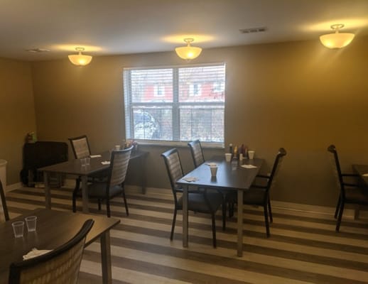 Dining room with tables set for residents
