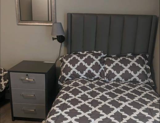 Cozy bedroom with a modern bed and bedside table