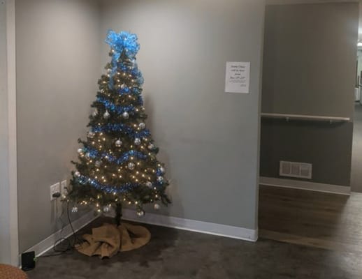 Christmas tree decorated in a hallway