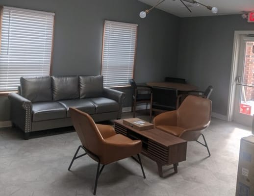 Cozy common area with seating and natural light