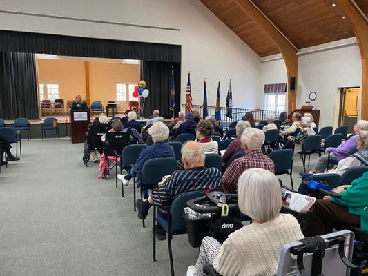 Residents attending a presentation in a community hall