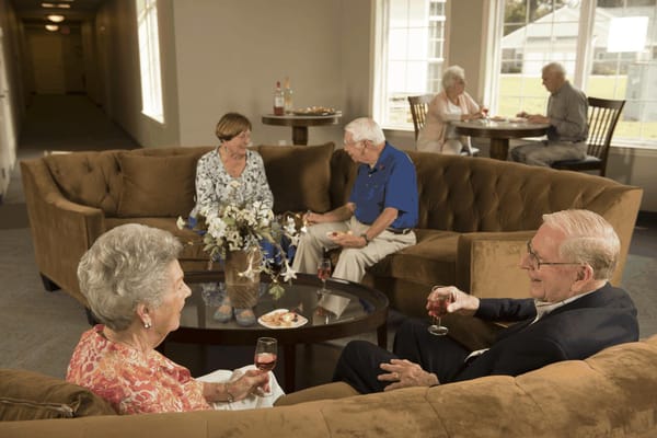 Residents enjoying snacks and drinks in a common area