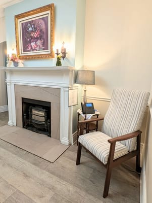 Cozy interior corner with a chair and fireplace