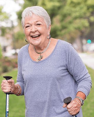 Smiling senior woman enjoying a walk outdoors