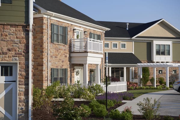 Exterior view of a senior living facility with landscaping