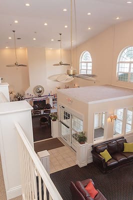 Bright common area with seating and large windows