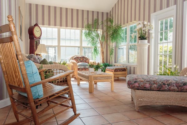 Bright interior common area with wicker furniture