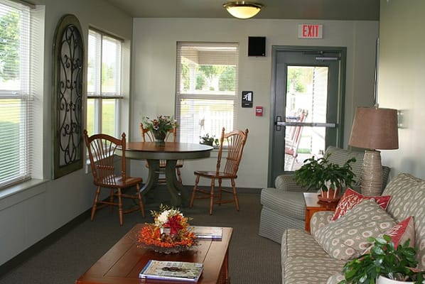 Cozy common area with chairs and a table