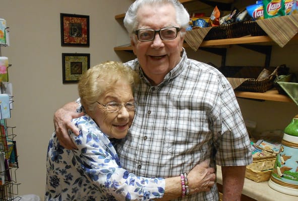 Two residents sharing a joyful moment in a cozy interior