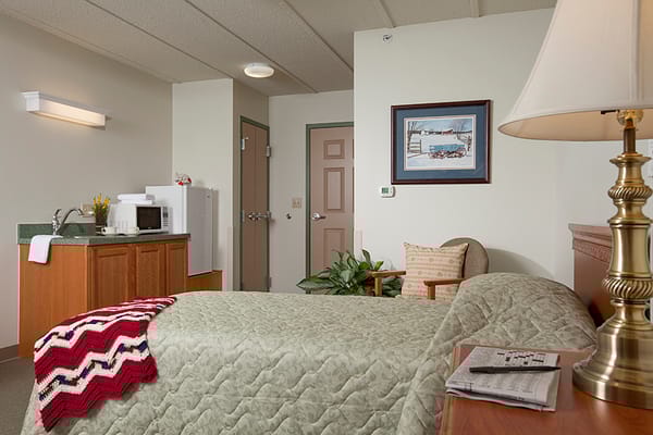 Cozy interior of a resident room with a kitchenette