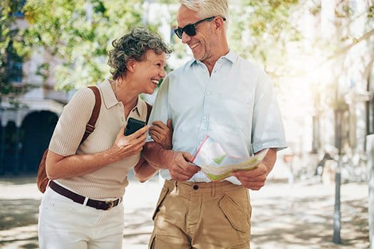 A happy couple enjoying a walk outdoors together