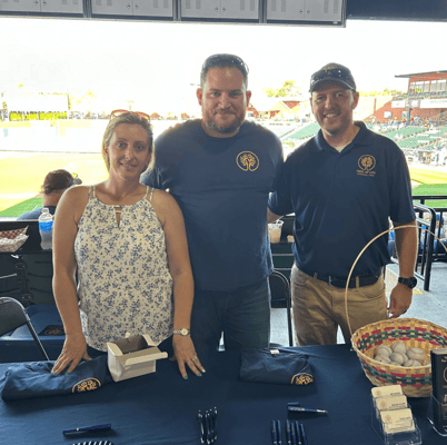 Staff members at an event promoting the facility