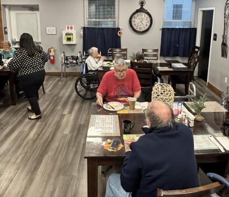 Residents enjoying a meal in the dining area