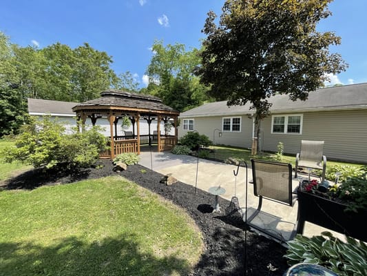 Outdoor gazebo in a landscaped garden area