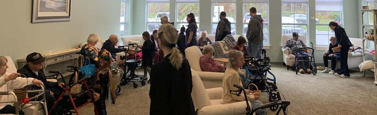 Residents and staff interacting in a bright common area
