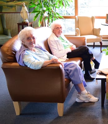 Two residents enjoying time together in a common area