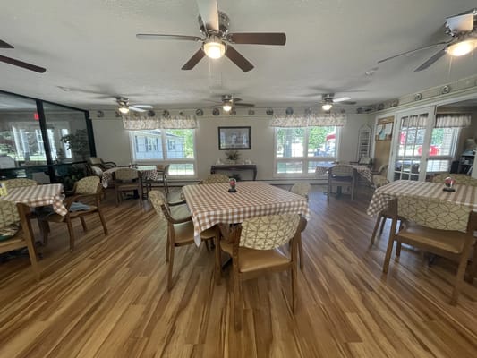 Bright dining area with tables and chairs