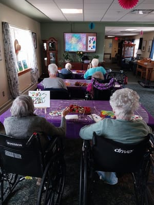 Residents participating in an art activity in a common area