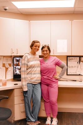 Staff members smiling in an office setting