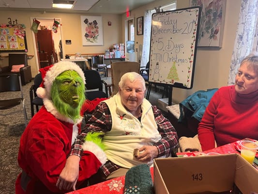 Residents enjoying a festive gathering with holiday decorations