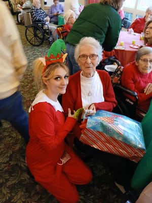 Residents enjoying a holiday celebration with staff