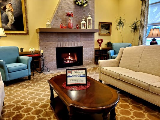 Cozy common area with a fireplace and seating