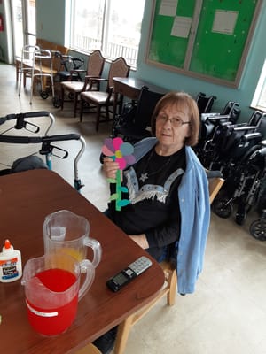 Resident participating in an arts and crafts activity