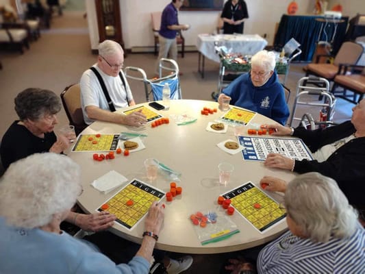 Residents playing bingo in a common area