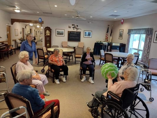 Residents participating in a group activity in a common area
