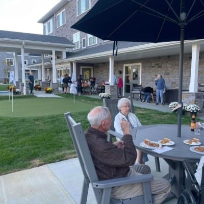 Residents enjoying an outdoor gathering with food
