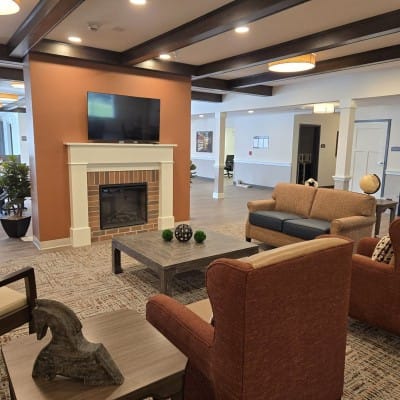 Cozy common area with seating and a fireplace