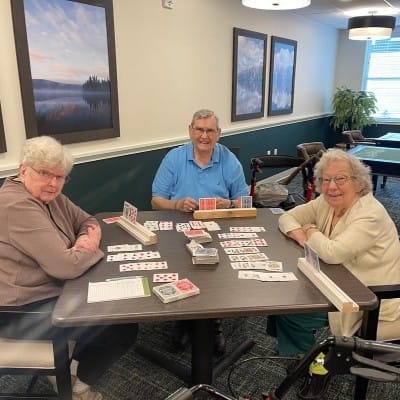 Residents playing cards in a common area