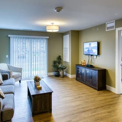 Bright common area with seating and television