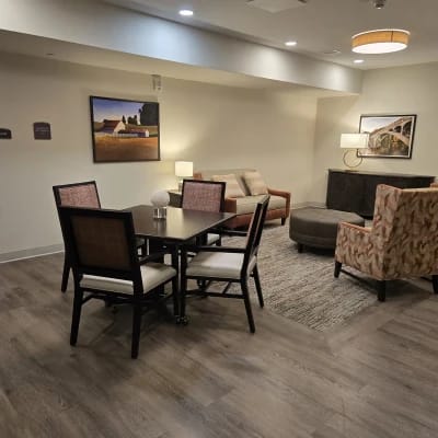 Bright lounge area with seating and artwork