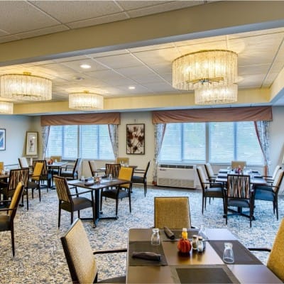 Bright dining room with elegant chandeliers and tables