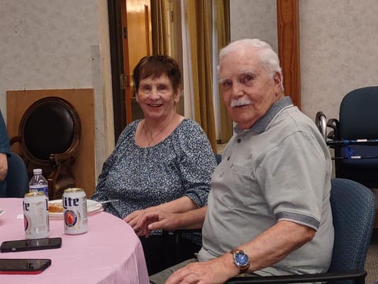 Two residents enjoying time in a common area