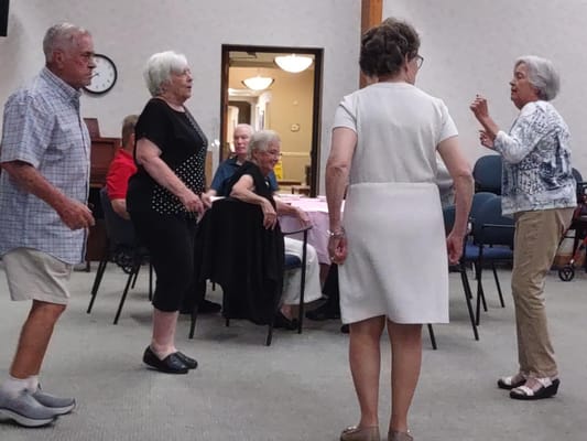 Residents participating in an activity in the common area